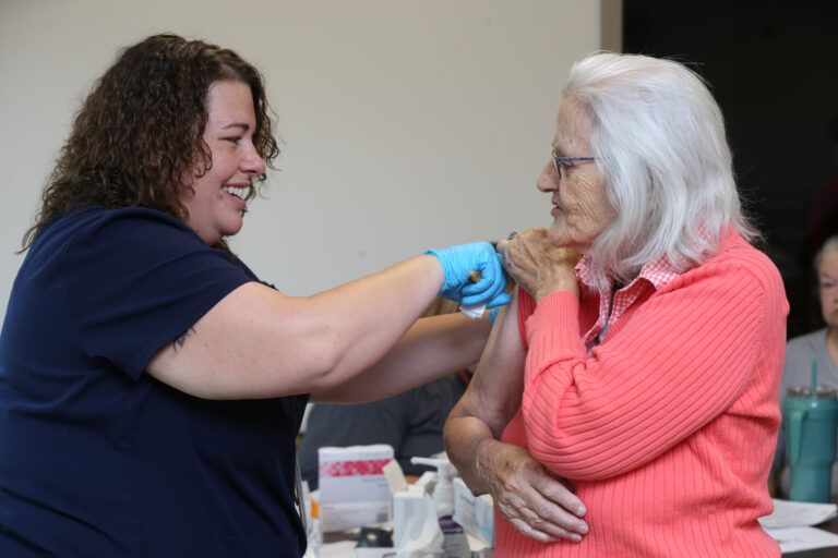 Woman receives vaccination