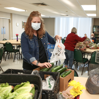 Woman bags veggies