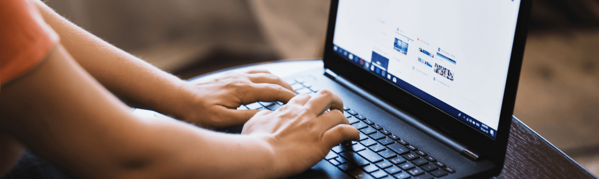 Typing on laptop computer