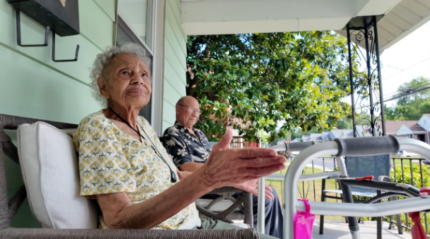 Senior couple sit on porch