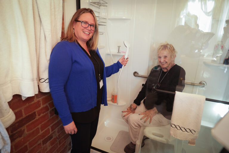 senior woman and caregiver demonstrating home modifications