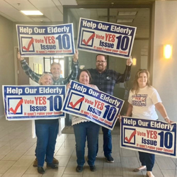 People with campaign signs