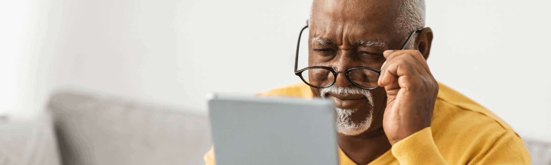 Senior man looking at tablet