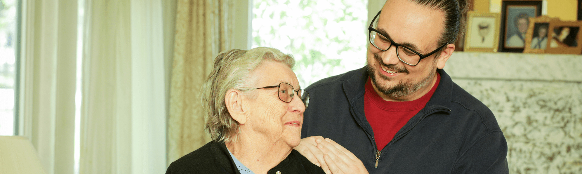 caretaker smiling at senior woman