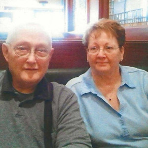 Couple sitting in a restaurant booth