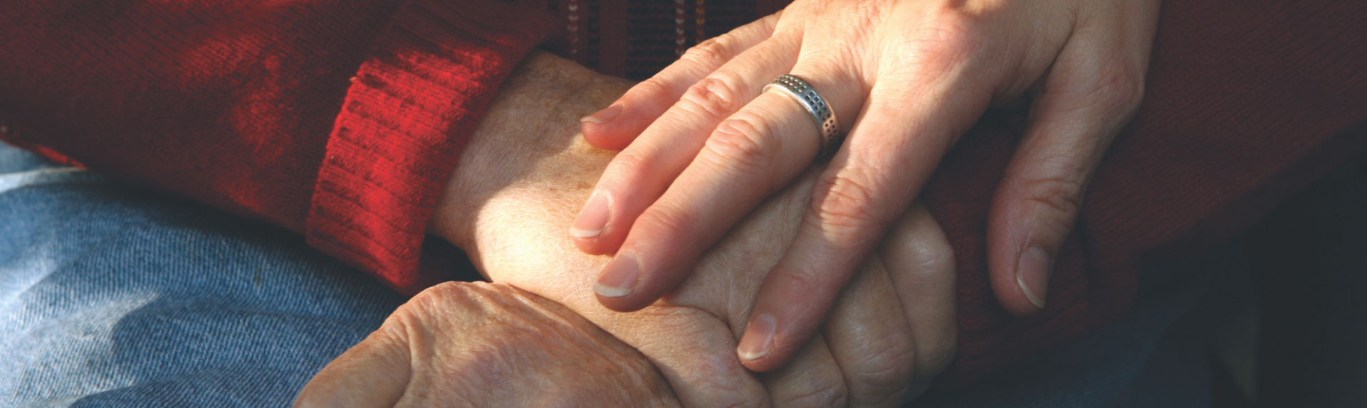 Close up of seniors holding hands