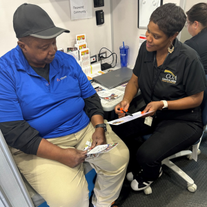 senior man and woman talk about a document