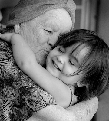 elderly woman and child in hug