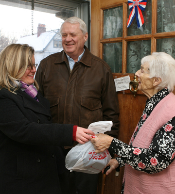 elderly woman receiving household goods